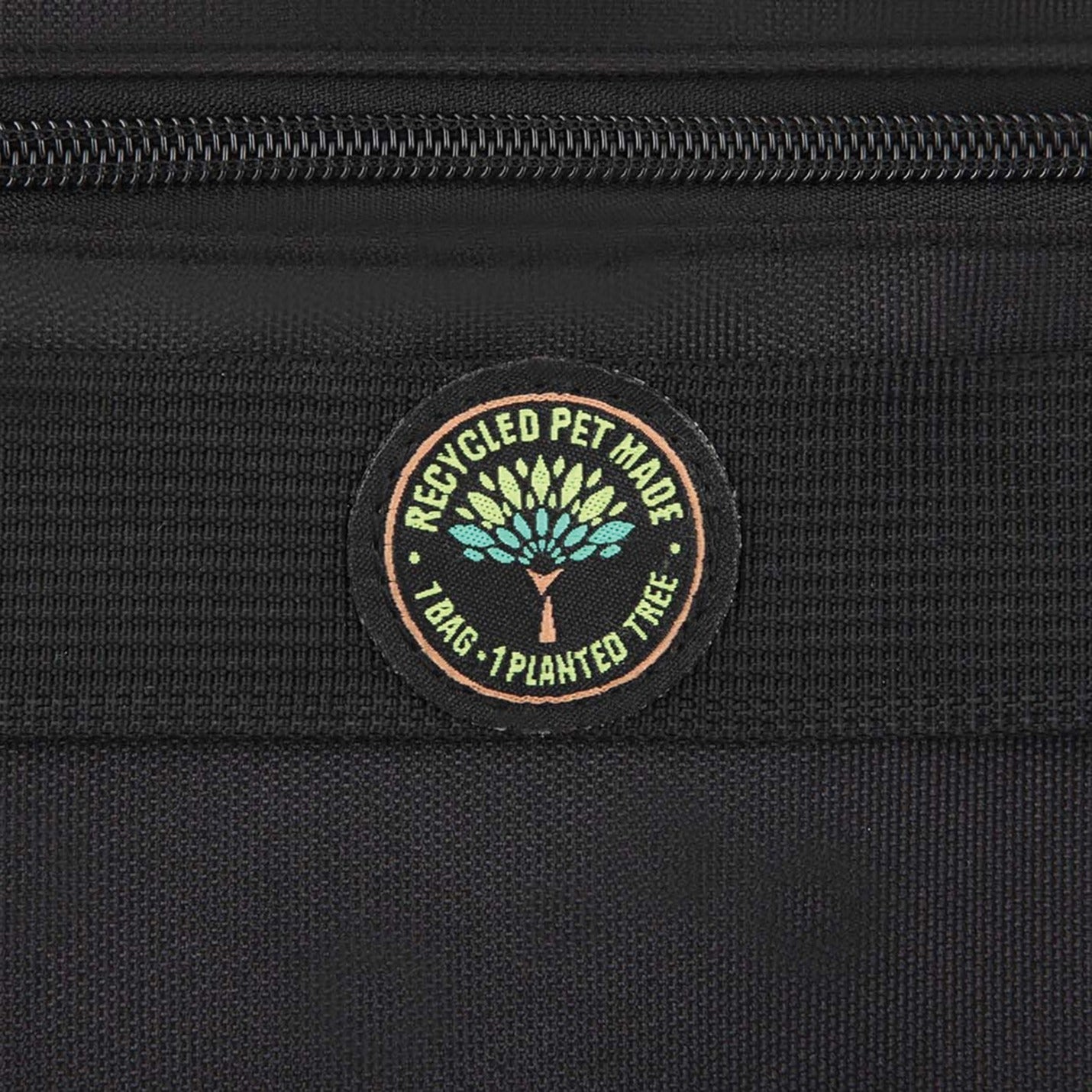 Close-up detail of recycled PET and tree planting certification badge on laptop case-alternate-image5