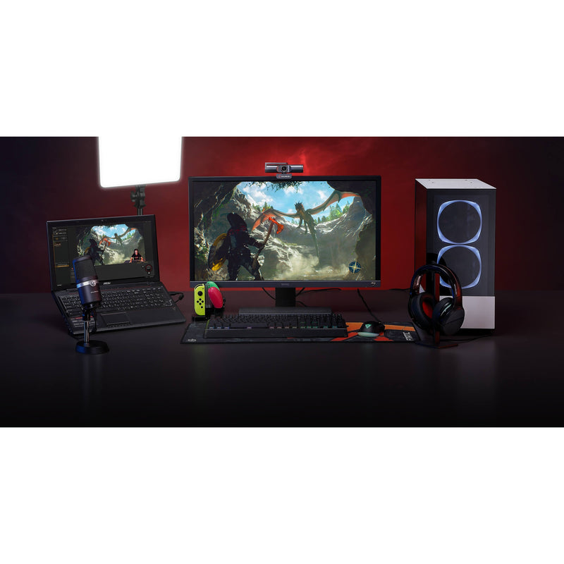 Wide shot of gaming setup with AVerMedia PW513 webcam and multiple displays