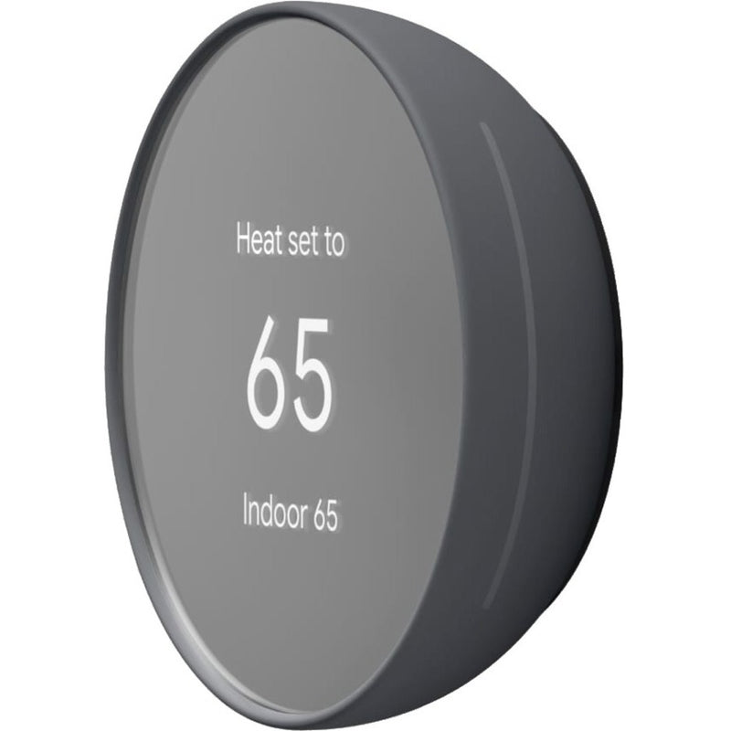 Angled view of Google Nest Thermostat displaying 65-degree temperature setting with charcoal finish