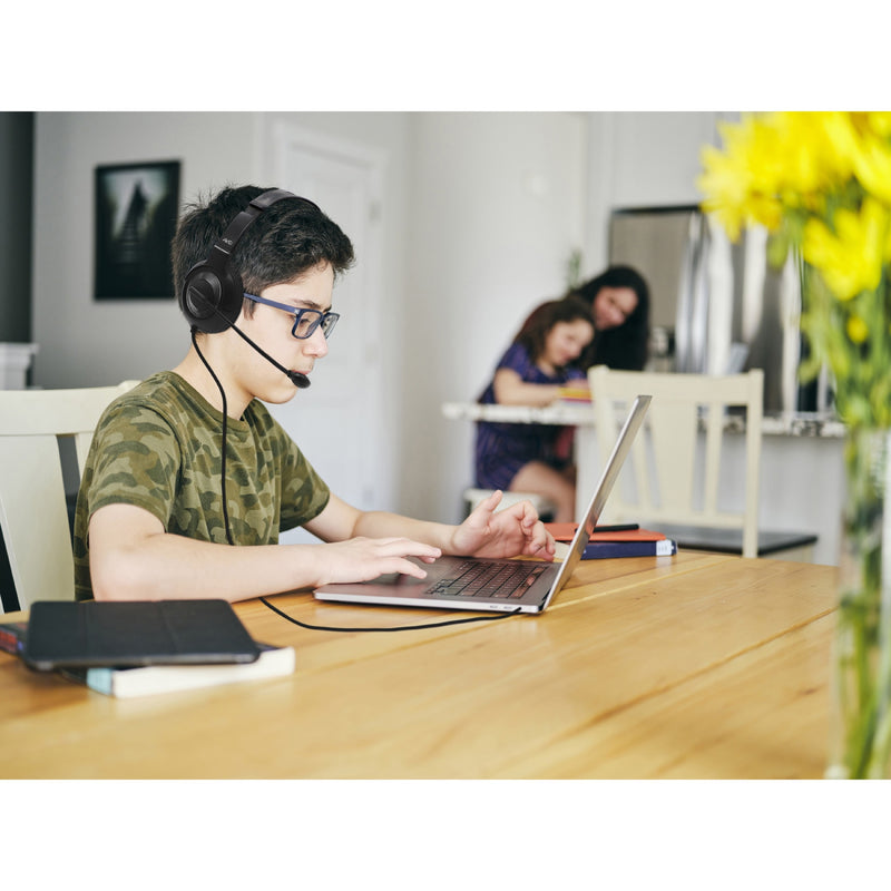 Student engaged in online learning with AE-55 headset in home study environment