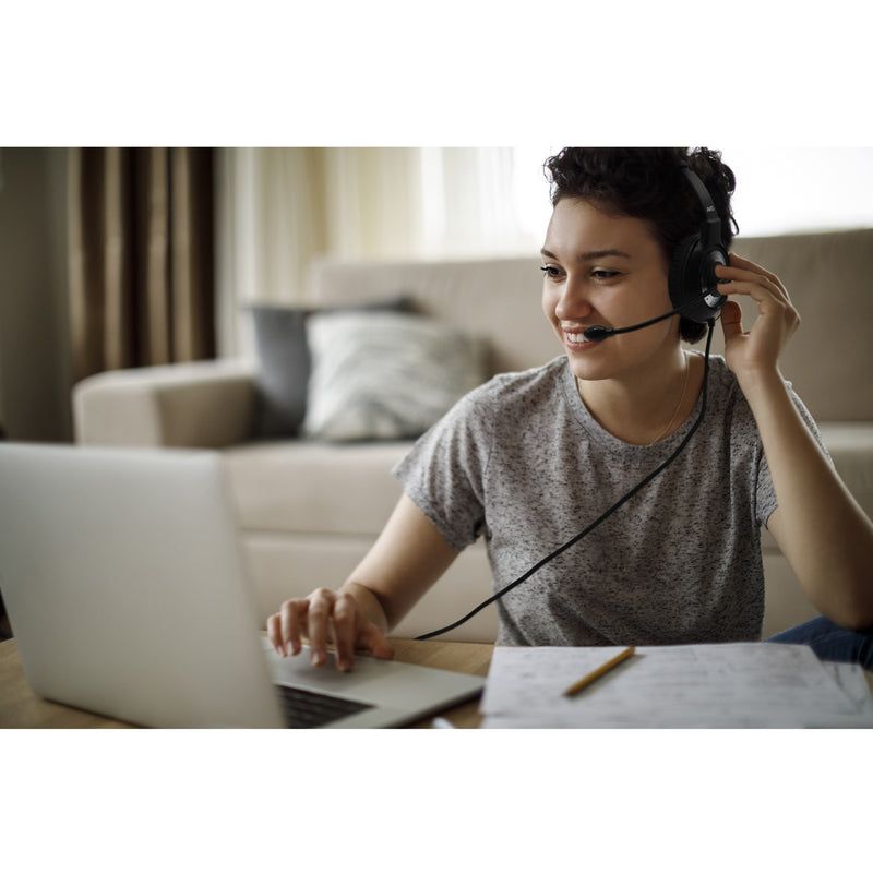 Student using Avid Education AE-55 headset while studying with laptop