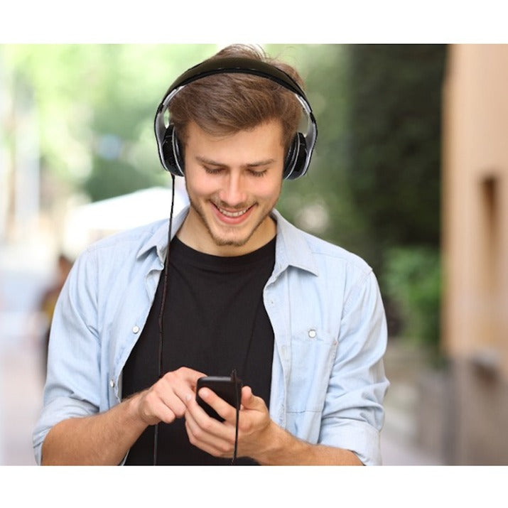 Person wearing Adesso Xtream P500 headphones while using smartphone