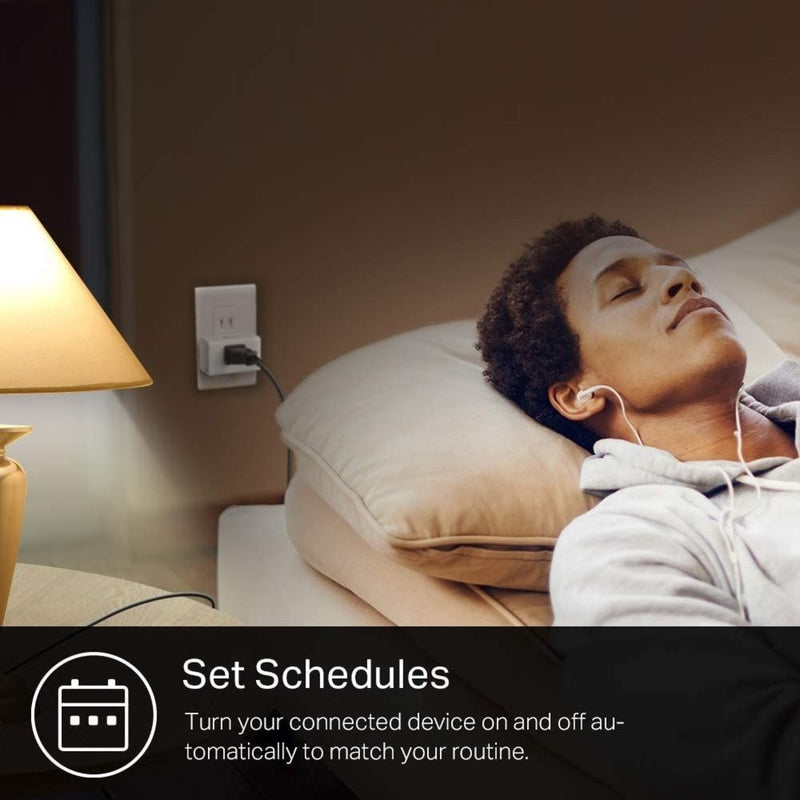 Person relaxing while smart plug automatically controls room lighting