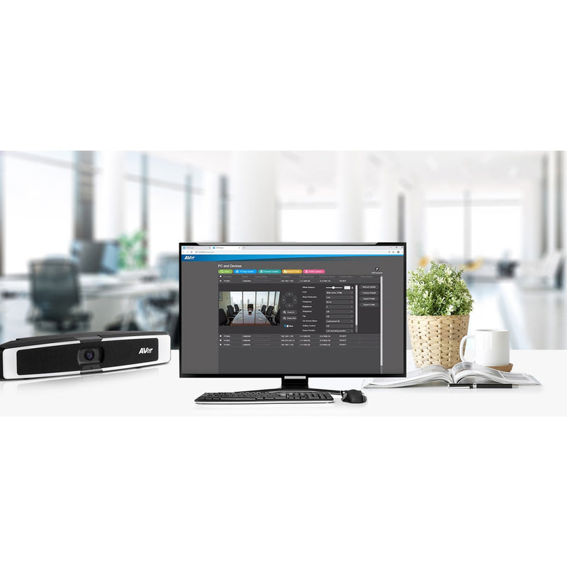 Desktop setup showing AVer VB130 management interface on monitor with videobar