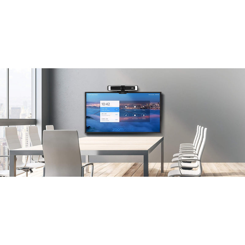 AVer VB130 mounted above display screen in modern conference room setting