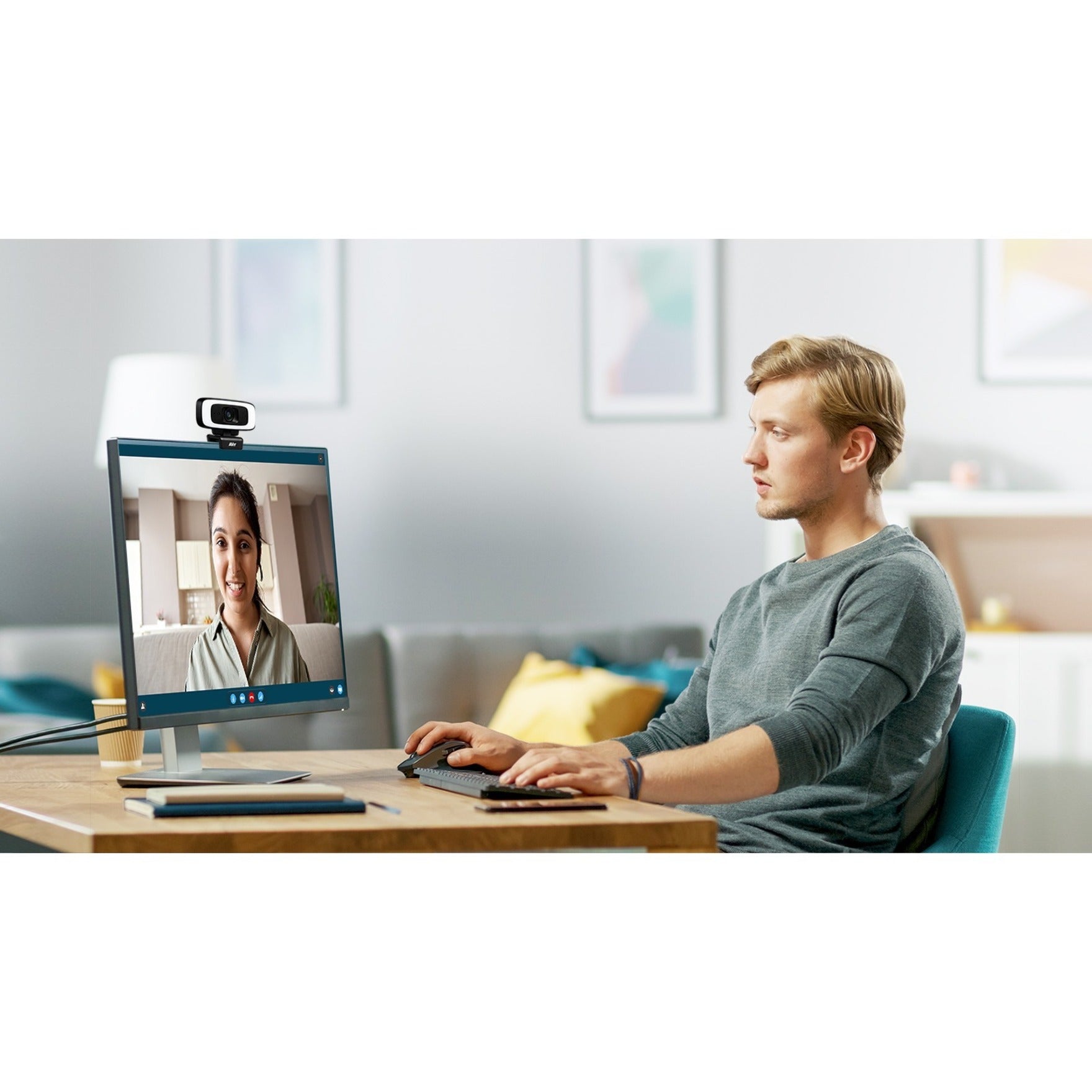 Professional using CAM130 webcam for video conference call in home office-alternate-image9