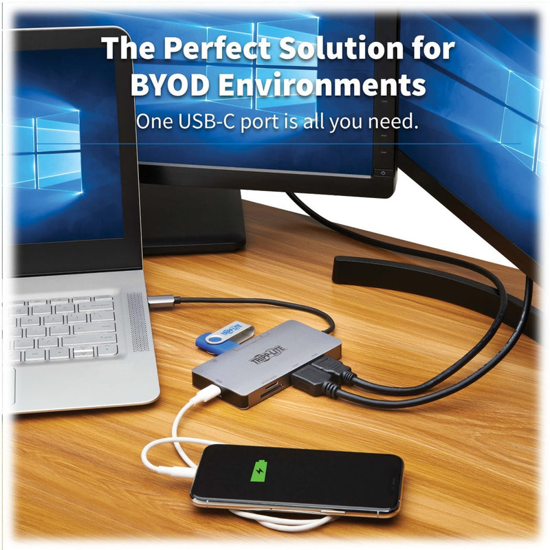 Real-world setup showing docking station connected to laptop and displays in BYOD environment