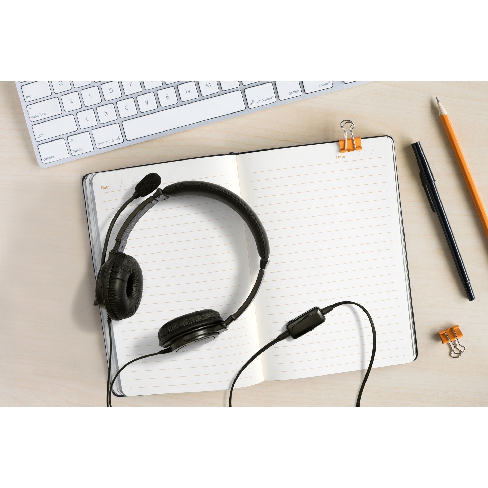 Kensington headset on desk with notebook and computer keyboard in home office setting-alternate-image7