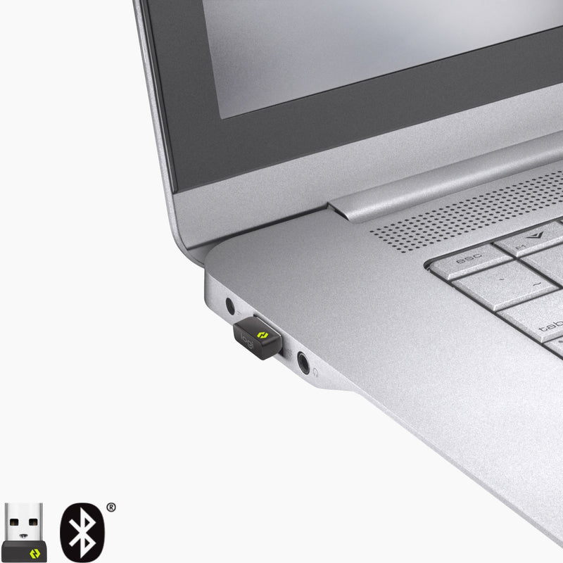 Close-up of Logi Bolt USB receiver inserted into laptop port with Bluetooth logo