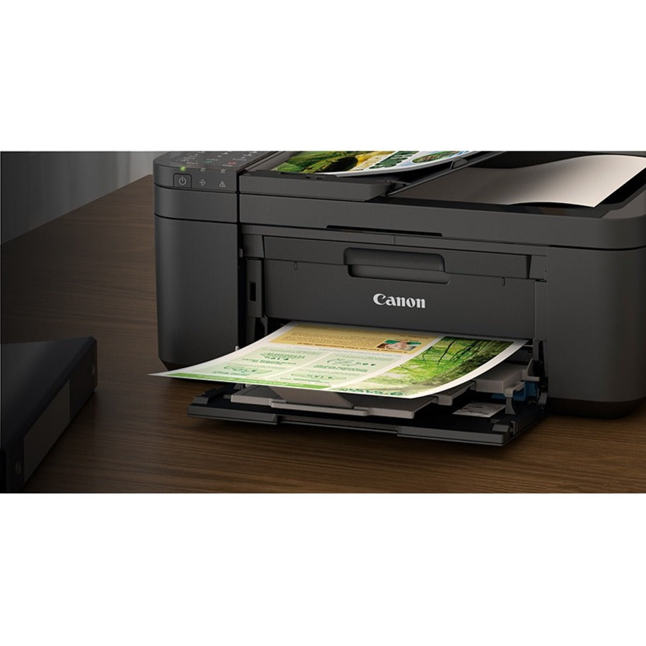 Canon PIXMA TR4720 printer shown in home office setting on wooden desk-alternate-image8