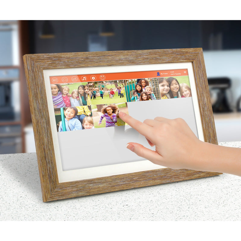 Hand touching digital photo frame screen showing multiple photos and control interface