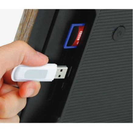 Close-up of USB drive being inserted into digital photo frame