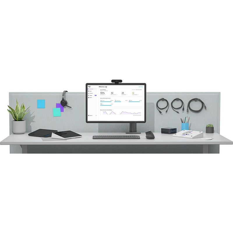 Logitech Tap IP integrated into a modern workspace setup with monitor and accessories