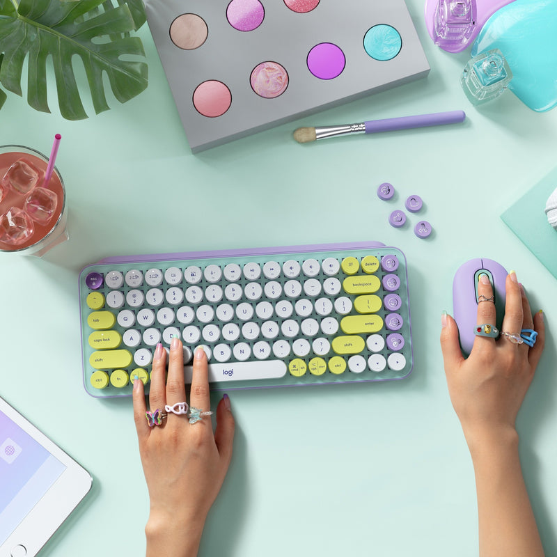 Lifestyle desk setup featuring POP Keys keyboard with matching accessories and decor