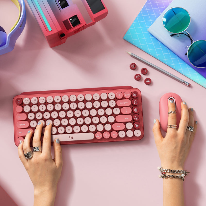 Overhead view of POP Keys keyboard with matching mouse and desk accessories in a modern workspace setting