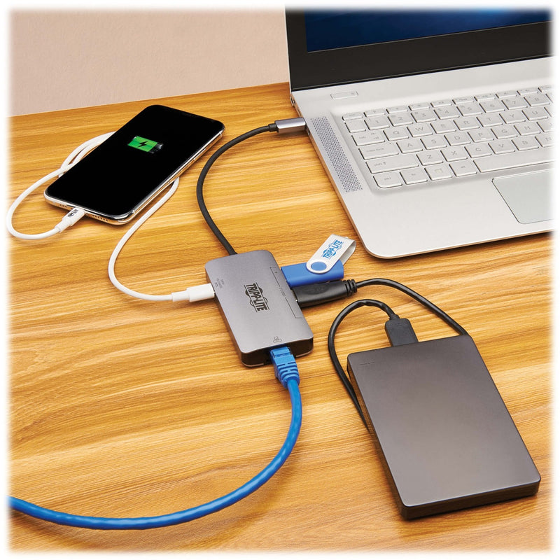 Tripp Lite USB-C hub connected to laptop with multiple devices