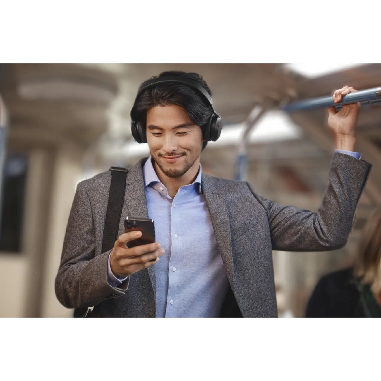 Professional using Jabra Evolve2 75 in urban setting-alternate-image11