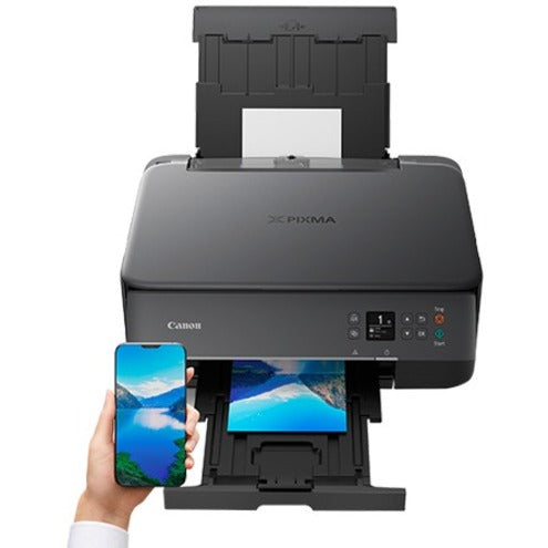 Canon PIXMA TS6420a demonstrating mobile printing capability with smartphone-alternate-image7