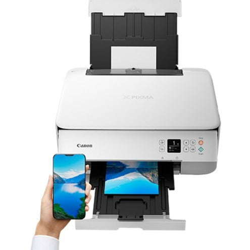 Canon printer demonstrating mobile printing capability with smartphone and photo print output-alternate-image3