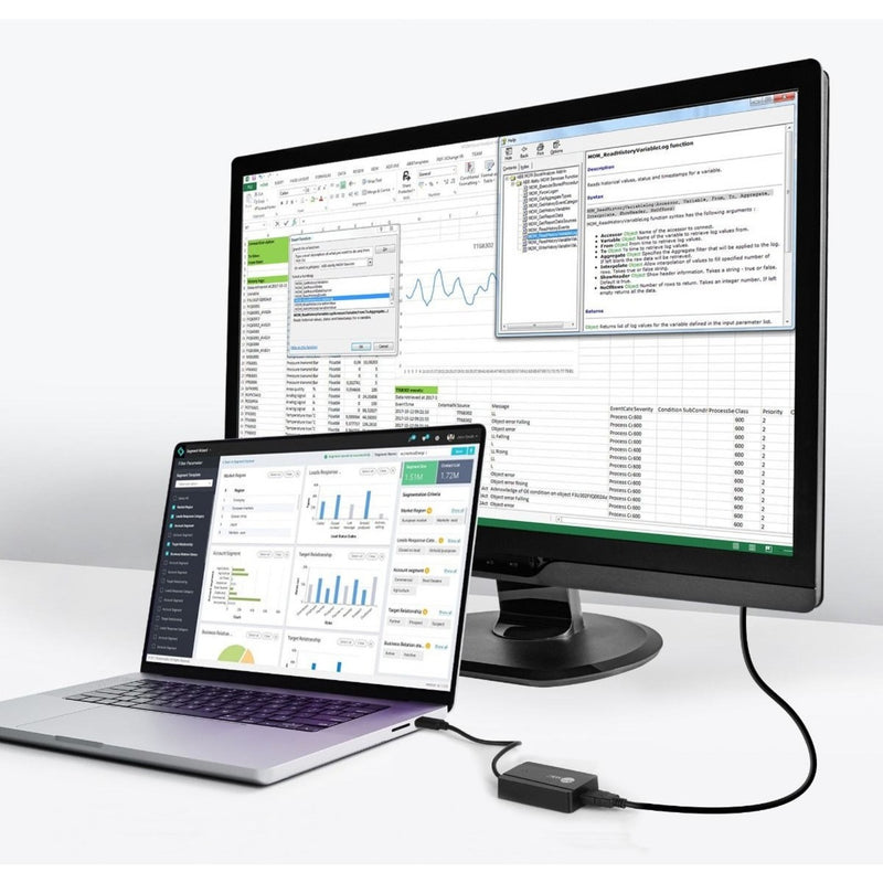 Laptop and monitor setup showing extended desktop functionality with adapter