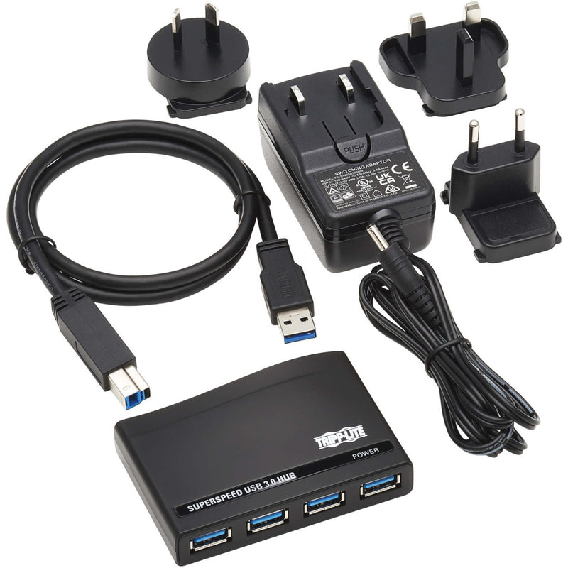 Complete package contents of Tripp Lite USB hub including power adapters and cables