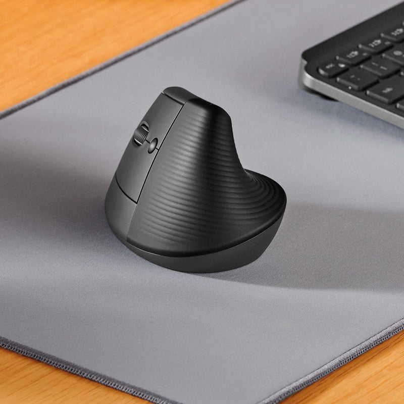 Side view of Logitech Lift Left Vertical Mouse on mousepad showing ergonomic angle