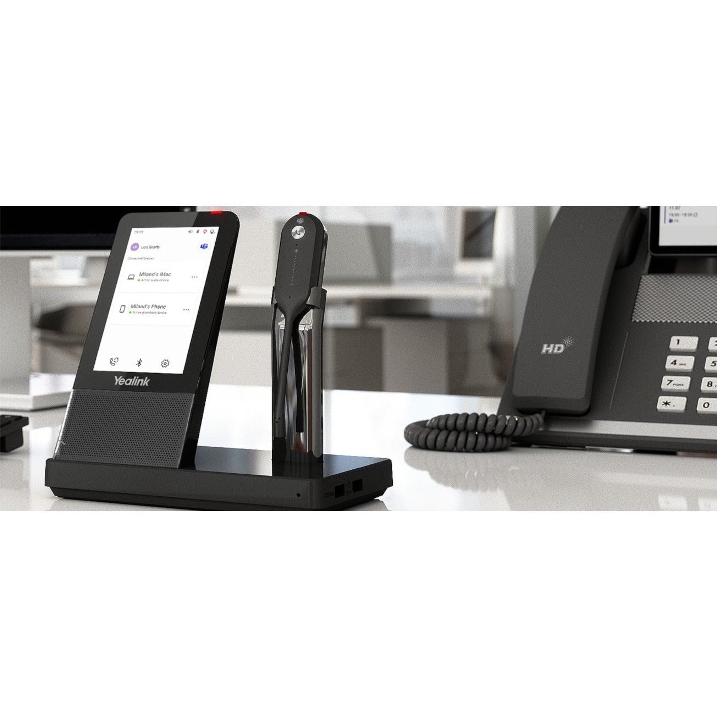 Yealink WH67 system in office setting with desk phone-alternate-image8