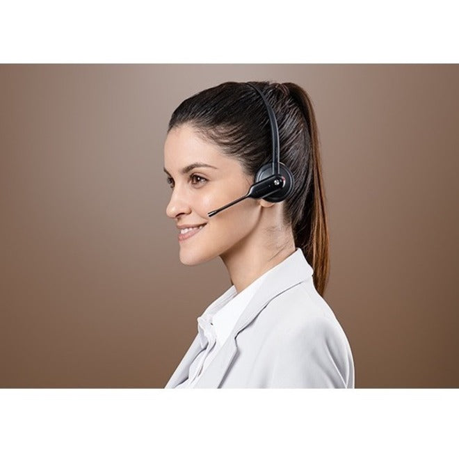 Side profile of professional wearing Yealink WH67 headset-alternate-image6