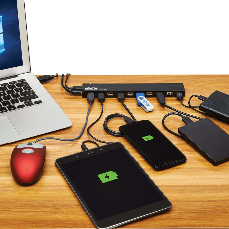 USB hub in use with multiple devices connected in a workspace setting