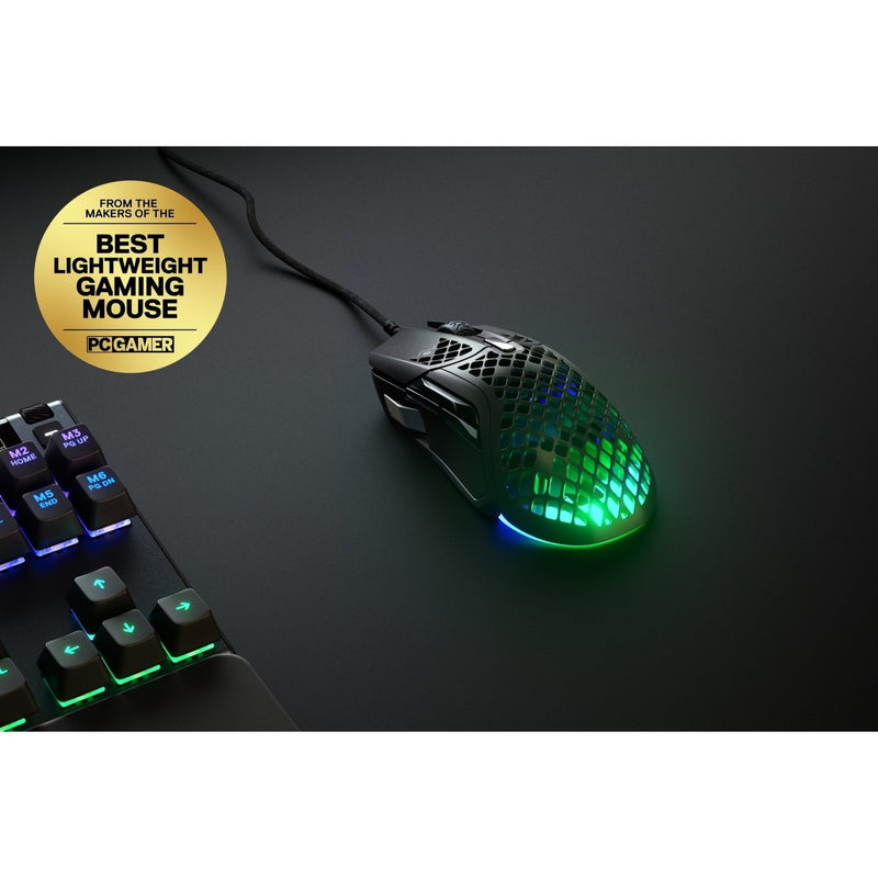 SteelSeries Aerox 5 gaming mouse with PC Gamer award badge next to gaming keyboard