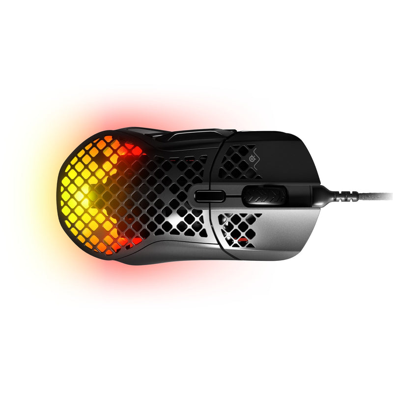 Top view of SteelSeries Aerox 5 gaming mouse displaying honeycomb pattern with orange-yellow RGB lighting