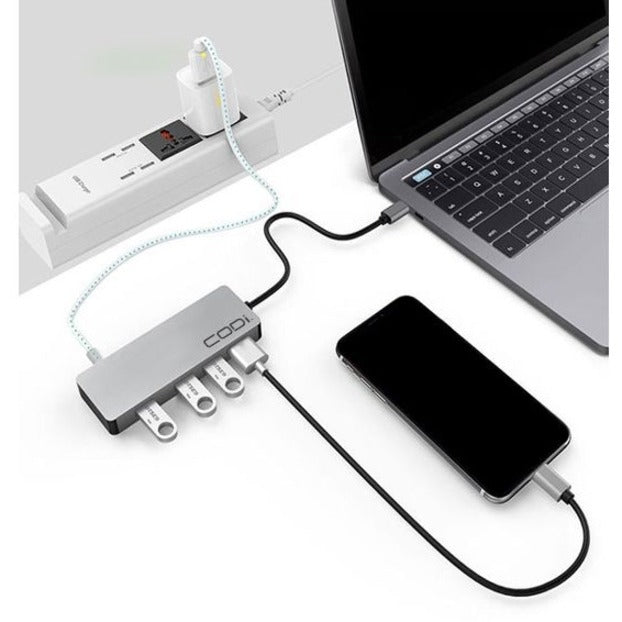 CODi USB-C hub in use with laptop, smartphone, and multiple USB devices connected