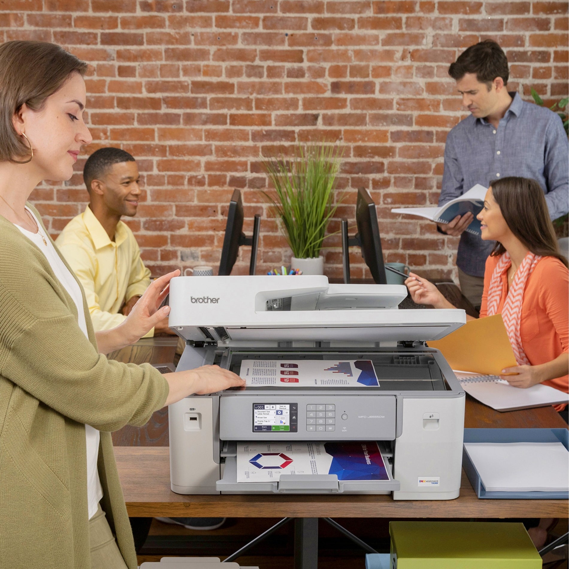 Office setting showing team members using Brother printer for business documents-alternate-image3