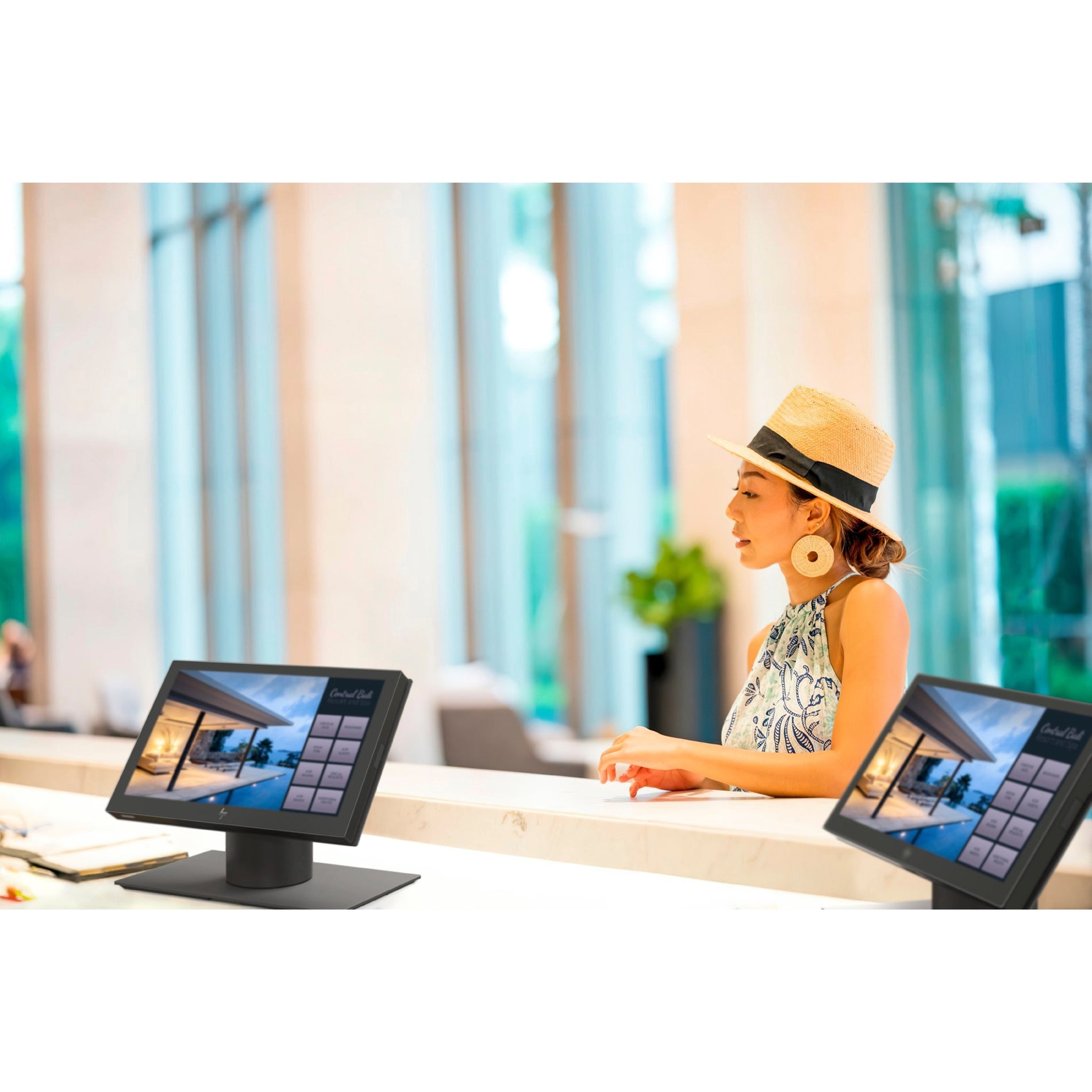 HP POS terminal being used at a hotel reception desk with guest interface displayed-alternate-image3