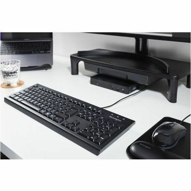 Desktop workspace showing Kensington mouse with keyboard and monitor setup