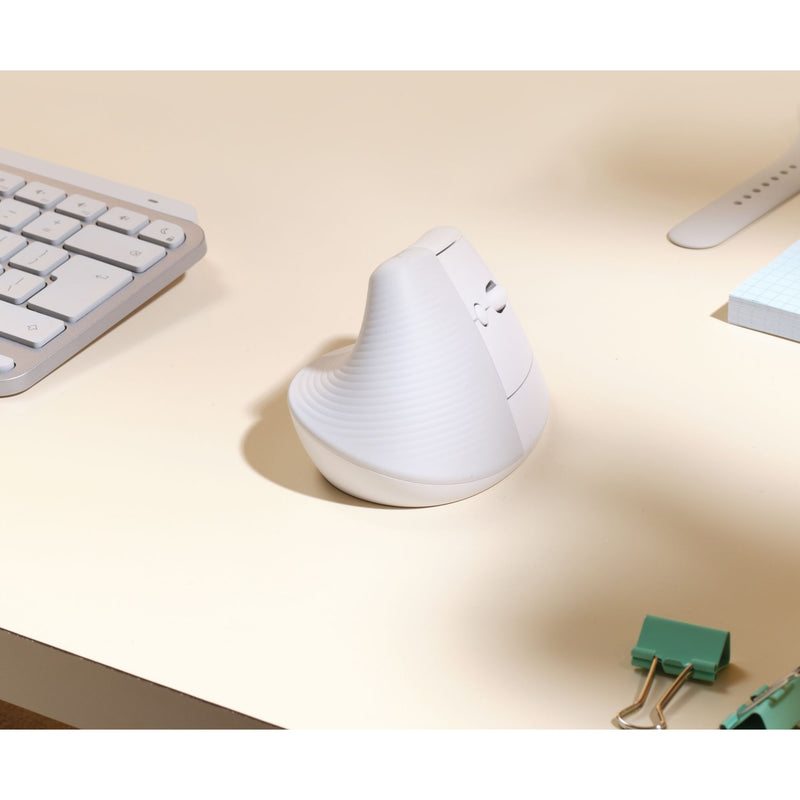 Side view of Logitech Lift vertical mouse on desk showing minimalist design