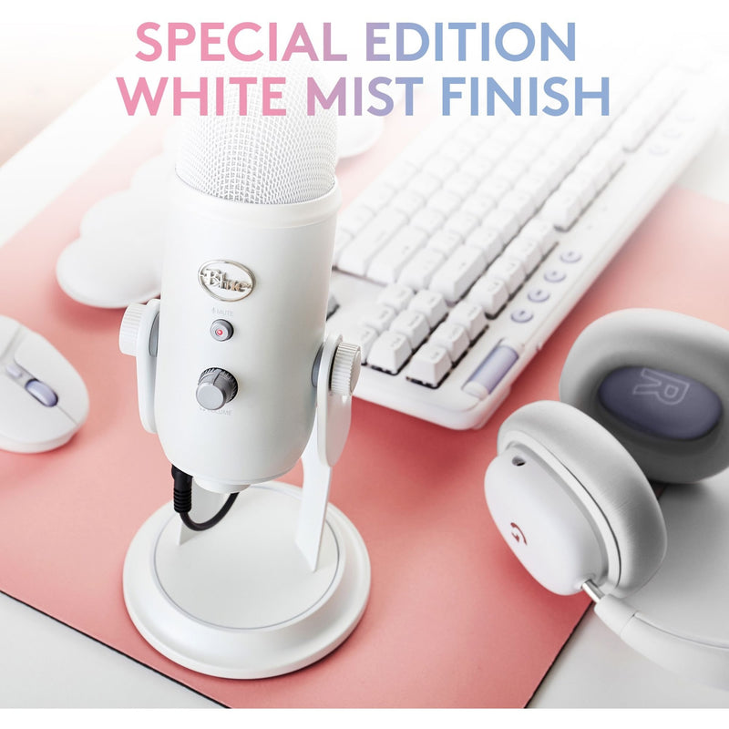 White Mist Yeti microphone with matching keyboard and accessories on pink surface