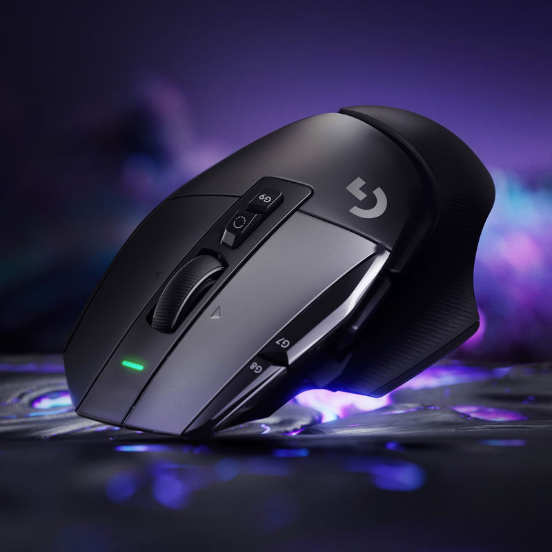 Logitech G502 X gaming mouse on purple background with LED indicator visible