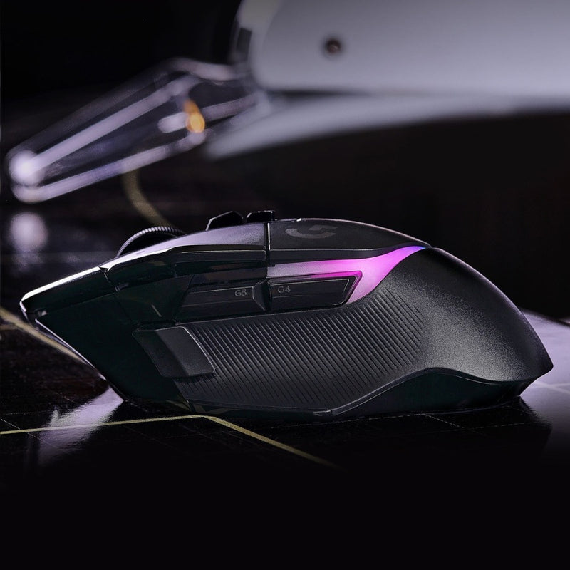 Profile view of G502 X PLUS gaming mouse displaying RGB lighting effects and ergonomic design