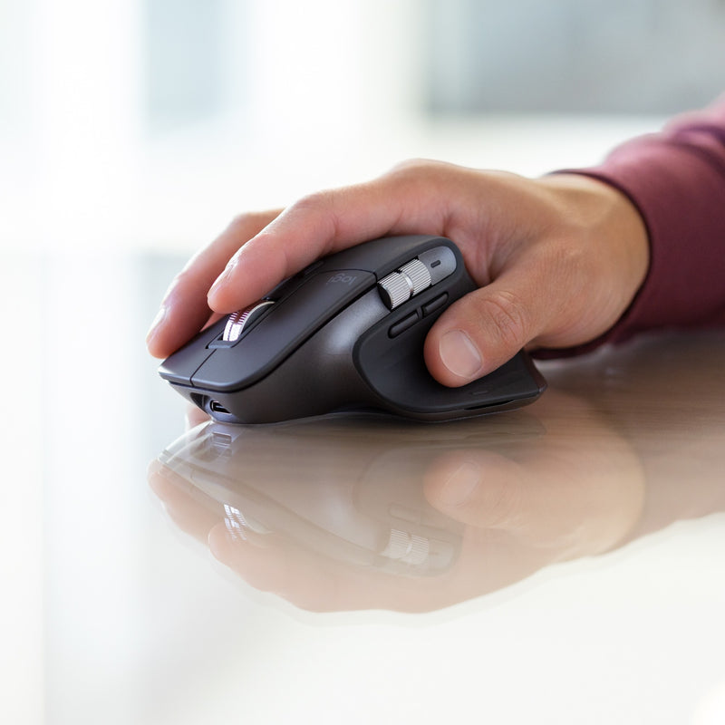 Side view of hand gripping MX Master 3S mouse showing ergonomic design