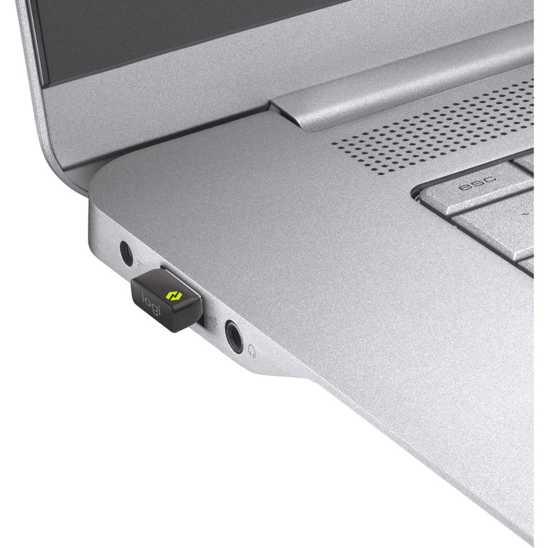 Logi Bolt USB receiver inserted into laptop USB port with LED indicator visible