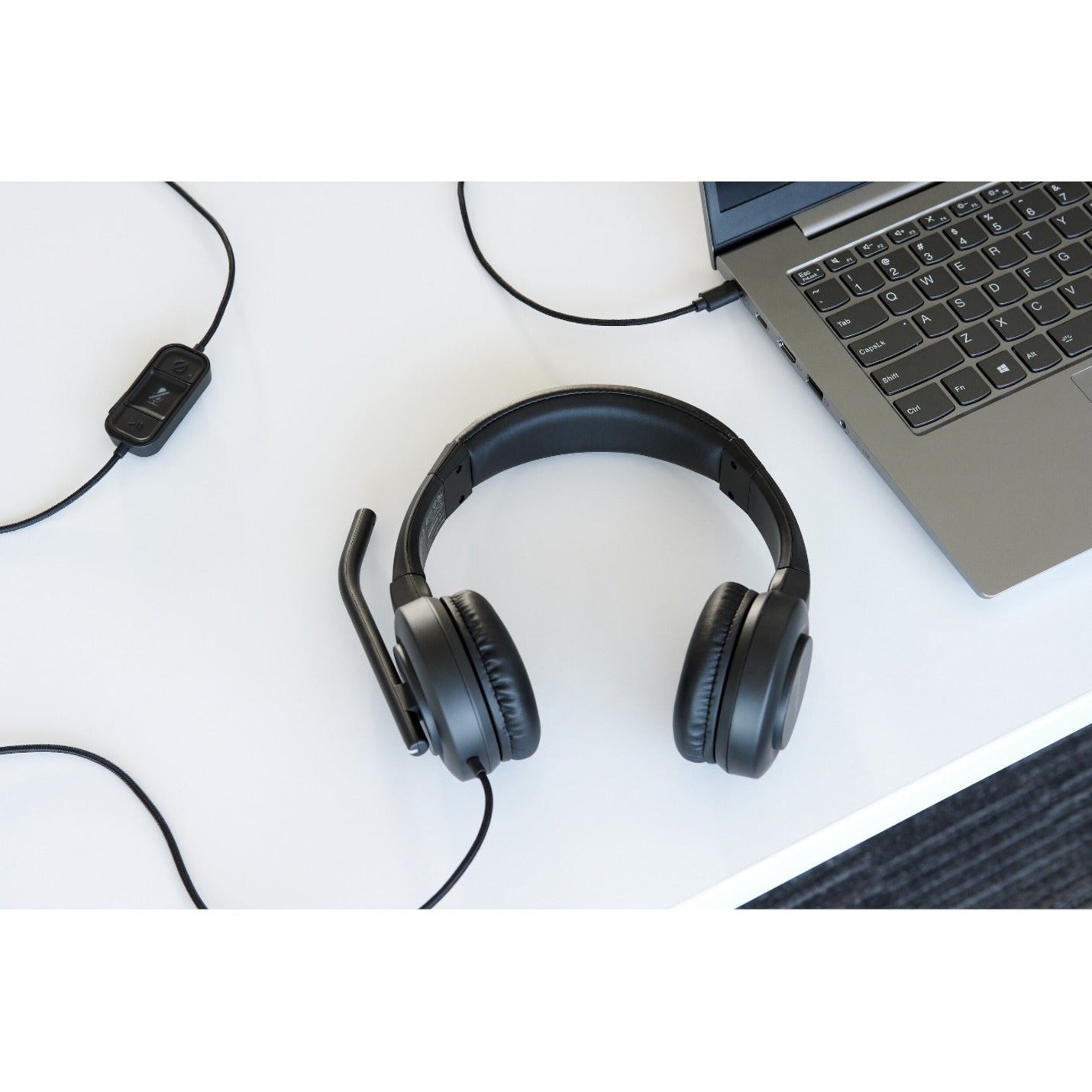 H1000 headset on desk with laptop showing workplace integration-alternate-image7