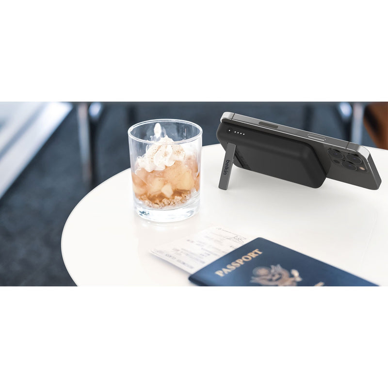 Lifestyle image of power bank on café table with passport