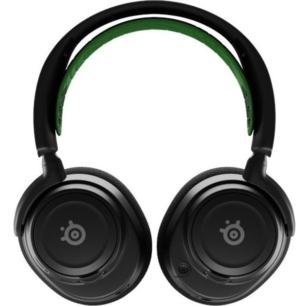 Front view of SteelSeries Arctis Nova 7X gaming headset showing black ear cups with SteelSeries logo and green headband accent-alternate-image1