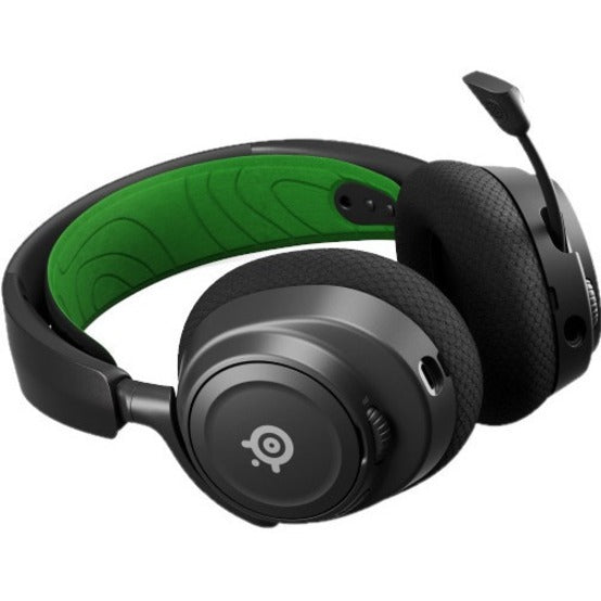 Side angle view of Arctis Nova 7X showing retractable microphone and green headband accent-alternate-image3