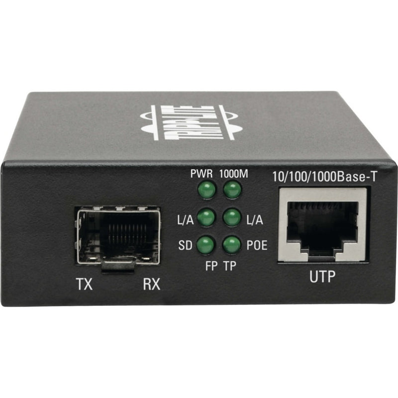 Close-up view of Tripp Lite media converter ports showing TX/RX fiber port and UTP connection