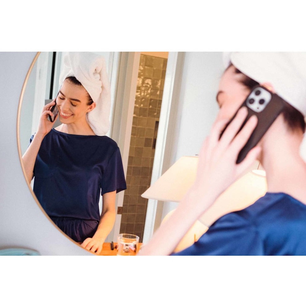 Person using iPhone with BookBook case while making a phone call in a well-lit room-alternate-image2