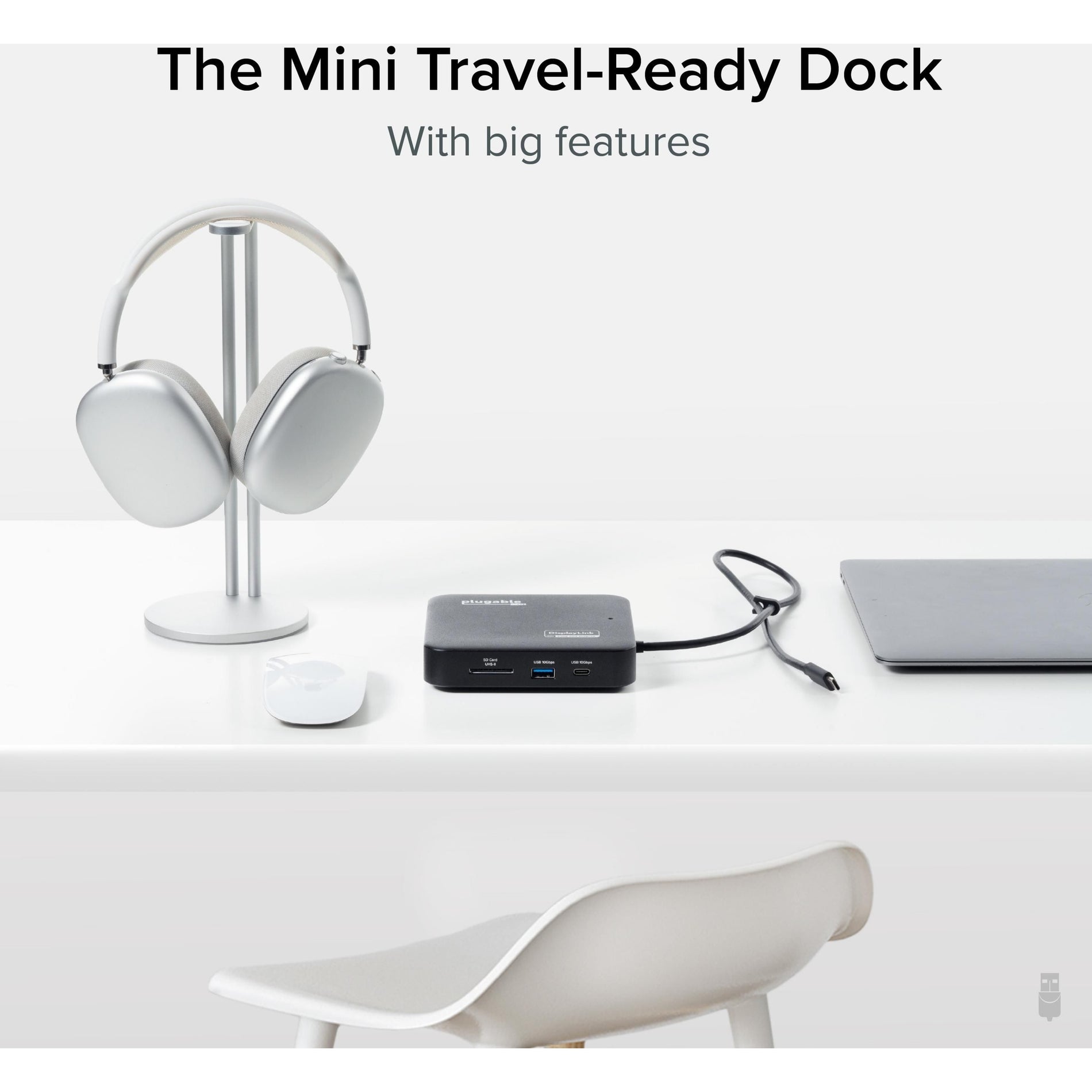 Lifestyle image showing the compact size of the docking station alongside travel accessories-alternate-image5