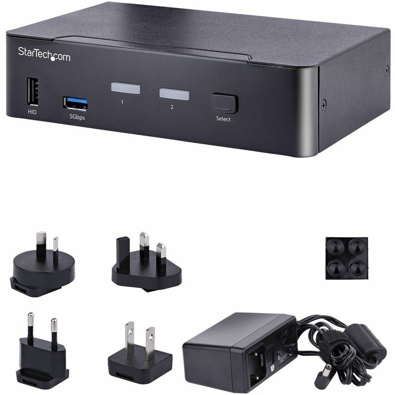 Complete package contents showing KVM switch, power adapters, and mounting accessories