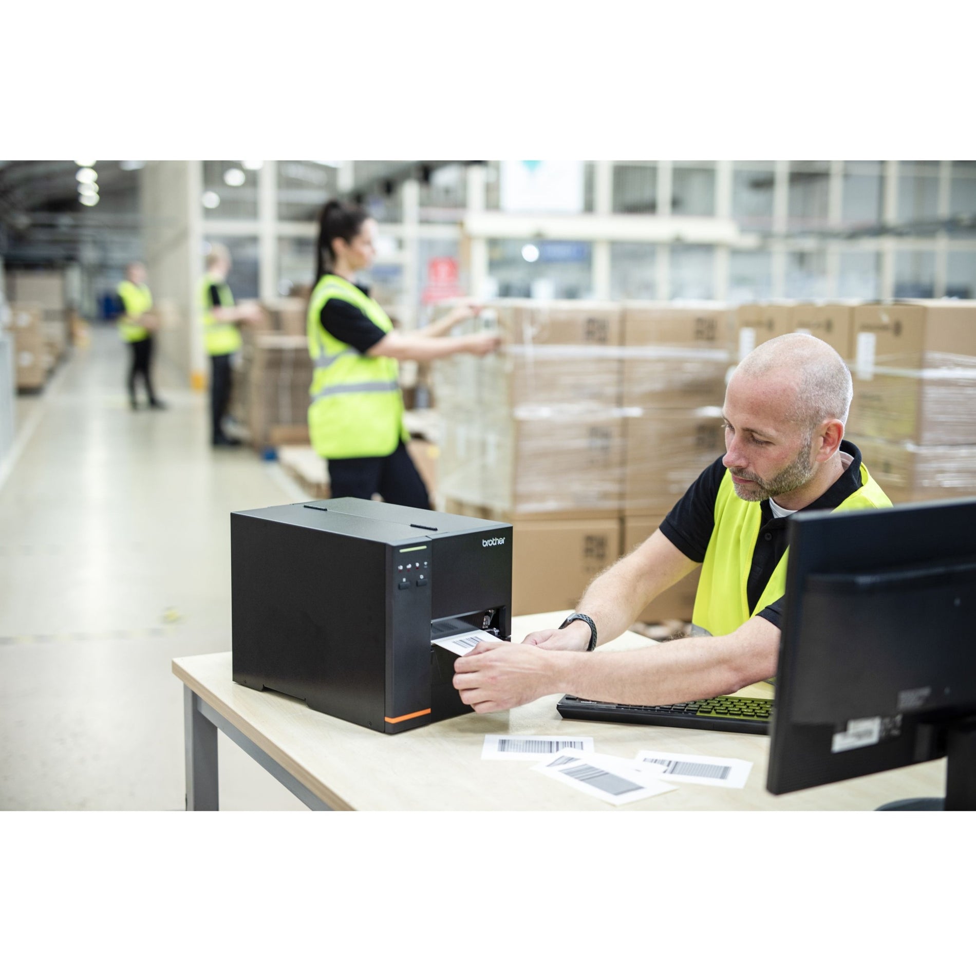 Warehouse worker using Brother TJ4120TN printer in distribution center-alternate-image6